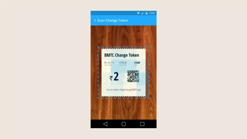 The redeemable BMTC change token on screen, scanned into a rider's wallet so no change is lost